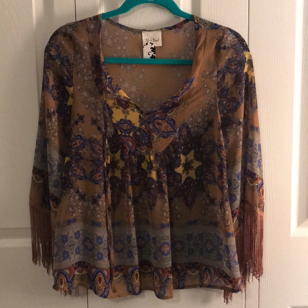 Patterned top with fringe sleeves, never worn